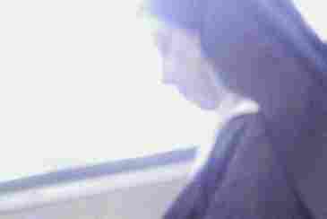A nun checks her cellphone on a Metro-North train, presumably quietly